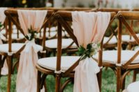 21 farmhouse chairs with peachy fabric, greenery and bloom posies for a soft look are ideal for spring