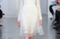 21 sheer layers and floral detailing make for a romantic walk down the aisle, a gown by Oscar de la Renta