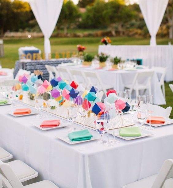 a colorful geometric wedding centerpiece of geo figures and bold colors is great for a modern wedding