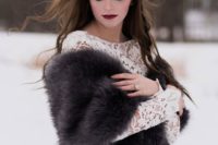 22 a moody winter bride rocking a dark lip and a dark faux fur coverup