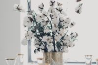 22 a wedding centerpiece of a brass vase and cotton branches looks wow and cute for winter