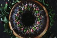 23 an ultimate chocolate bundt cake with sugared cranberries, pistachios and int leaves