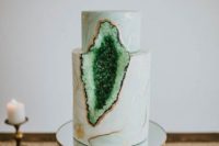 24 a marble wedding cake with ombre green geode decor and gilded edges