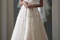 24 an illusion plunging neckline wedding dress with floral appliques looks sexy and romantic