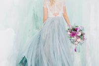 24 the bride in a lace top, a grey layered skirt in an ice cave