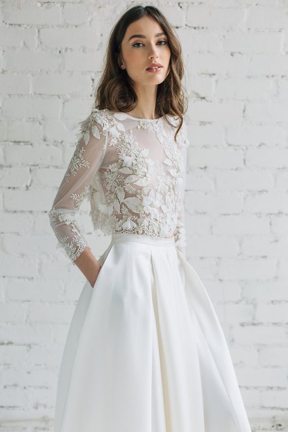 a delicate bridal separate with an illusion bodice with appliques and half sleeves and a full skirt