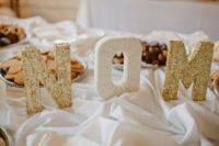 25 gold glitter letters with your inititals are a great idea to accentuate any wedding space