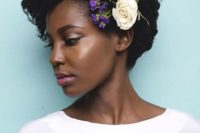 25 naturally curly short hairstyle highlighted with fesh purple and white blooms on one side