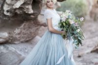26 a lace short sleeve top with a blue tulle skirt looks trendy and ethereal and shows off winter shades