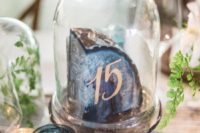 26 a large agate slice with a table number in a cloche is a great idea for a modern trendy wedding