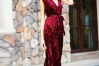 26 a red velvet belted jumpsuit with no sleeves and a sash is a gorgeous idea that is in trend