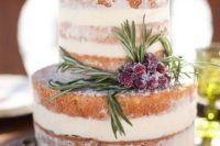 26 a semi naked wedding cake with rosemary and sugared cranberries for a boho wedding