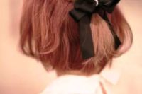 26 red short hair with braids on top and a black bow with rhinestones for an elegant modern bride
