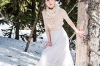 28 a simple bridal separate with a blush draped top with half sleeves and a layered full skirt plus a faux fur scarf for outdoor shots