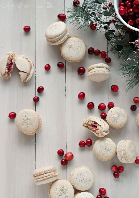 orange walnut macarons with spiced cream cheese and cranberry filling for a winter dessert table