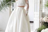 30 a trendy bridal separate with a pleated high low full skirt with pockets and a long sleeve crop top with appliques