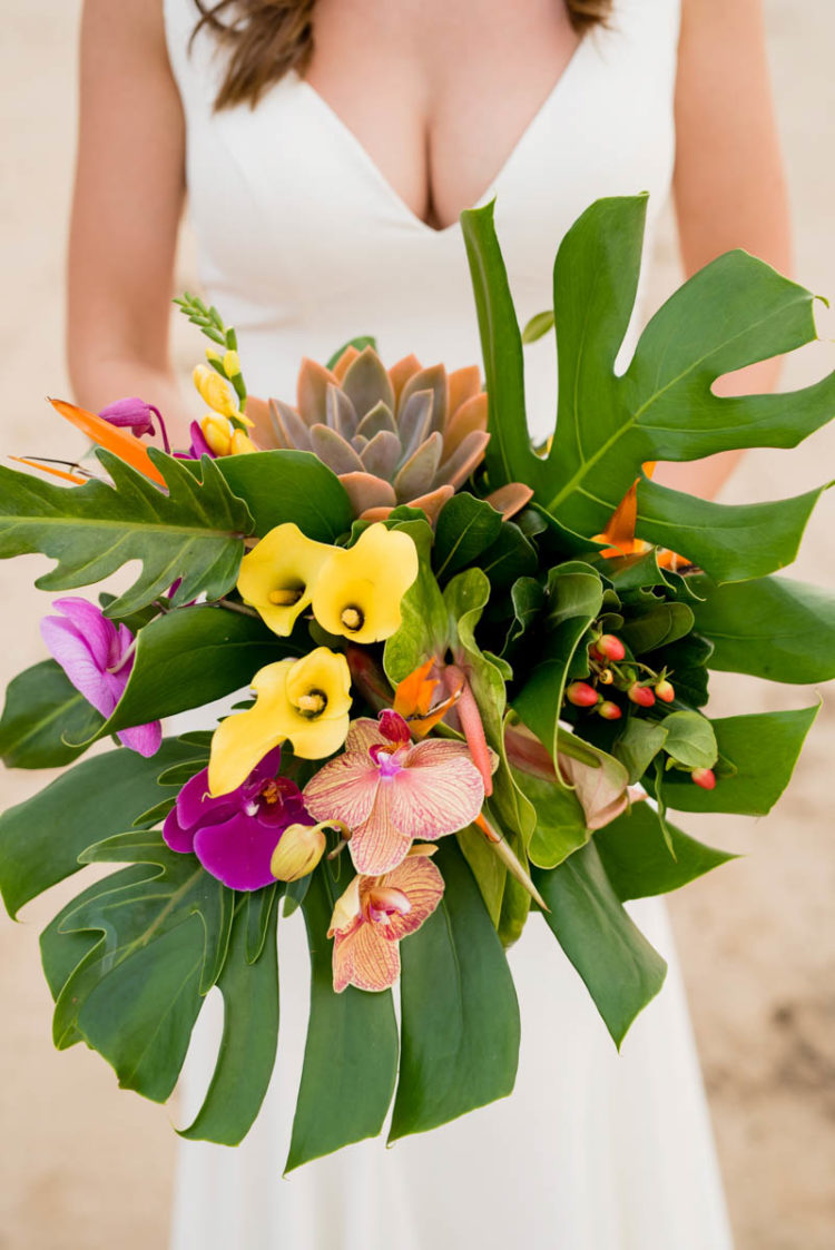 The wedding bouquet was a gorgeous tropical one, with tropical leaves, callas and orchids