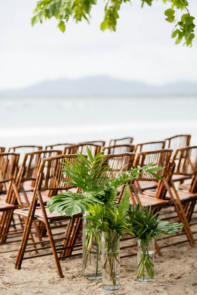 Flora was an important part of the wedding decor, and tropical leaves were used for the ceremony space