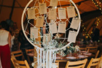 02 The bride made many decor elements herself, for example, large dream catchers like this seating chart