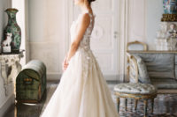 02 The bride was wearing a beautiful lace applique wedding dress with a train and an illusion neckline