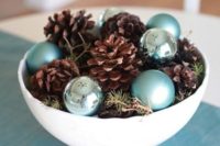 02 a bowl with pinecones, evergreens and blue and silver ornaments for a winter centerpiece