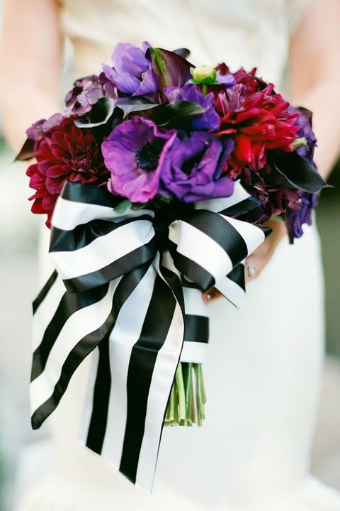 striped black and white ribbon with a large bow to make the bouquet stand out