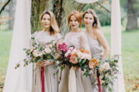 03 The bridesmaids were wearing dove grey dresses and carried blush rose and foliage bouquets
