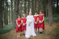 The bridesmaids were wearing red high low dresses with different accessories and shoes