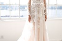 03 a blush wedding dress with a plunging neckline, illusion sleeves and white lace floral appliques