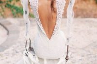 03 a boho lace wedding dress with a low cutout back, no sleeves and a cap veil for a cool matching look