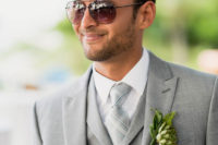 04 The groom was wearing a light grey three-piece suit and a checked tie