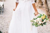 04 a chic wedding dress with a lace bodice and half sleeves, an ethereal skirt and a V cutout