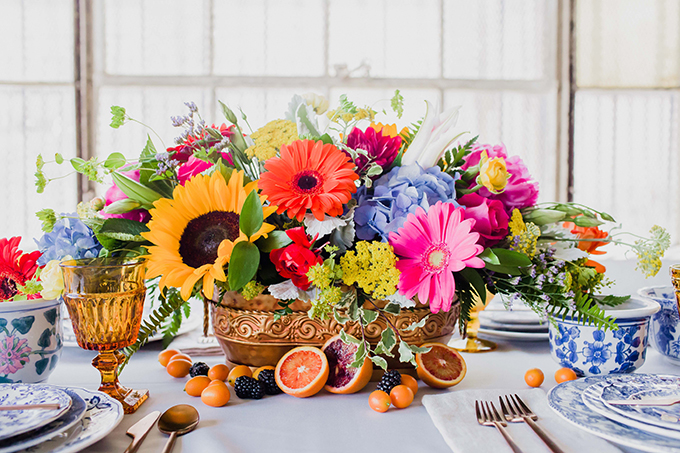 The wedding centerpiece was a very colorful one, with pink, lavender, orange and yellow blooms and in a copper bowl