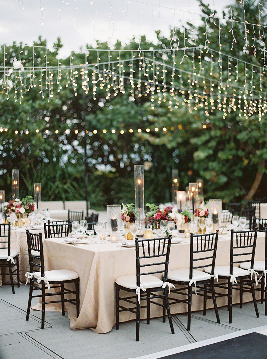 The wedding reception was rather glamorous, with bold blooms, candles and lots of lights