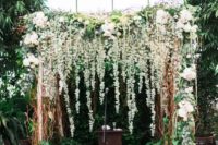 07 a gorgeous lush floral and greenery backdrop with an arch to feel like outdoors