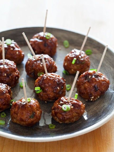 meat balls with greenery served on toothpicks is a great idea fo comfort food