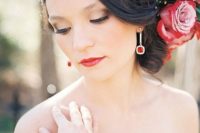 07 statement red stone earrings match the red lips and flowers in the bride’s hair