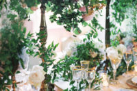 wedding table decor with lots of greenery