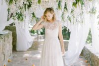 08 an ethereal short sleeve wedding dress with a sweetheart neckline, lace appliques and a lace skirt