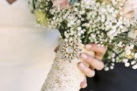 08 lace bouquet wrap with a vintage brooch is great for a vintage bride