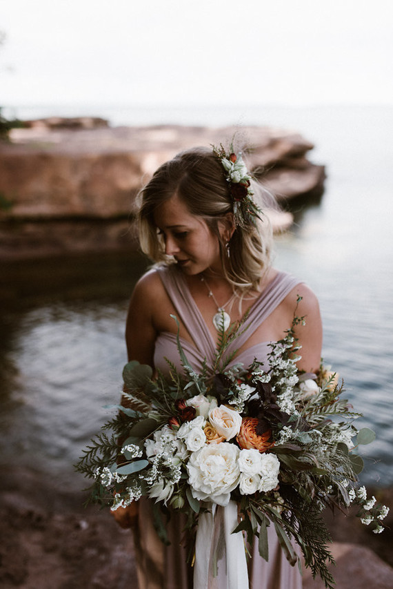 The bridal bouquet was a lush one, with white and orange blooms and lots of greenery