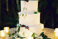 09 The wedding cake was a textural white one, with fresh greenery and berries and candles around