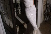 10 a breathtaking embellished strapless mermaid wedding dress with a layered tail and a mask
