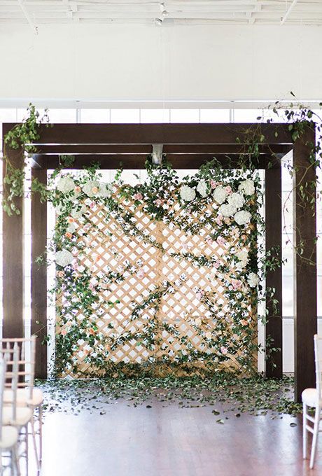 an arbor with a greenery wall will make everyone fell like outdoors in the garden