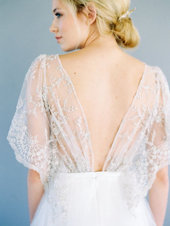 an open back with airy embroidered and beaded details