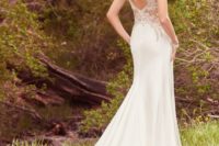 10 lace applique embellished wedding dress with a partly cutout back and a train
