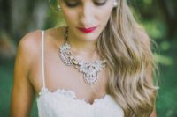 11 unique and pretty statement necklace accentuates the sweetheart neckline