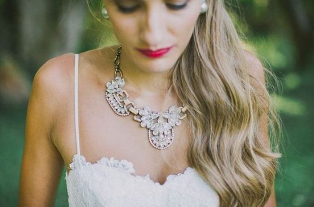unique and pretty statement necklace accentuates the sweetheart neckline