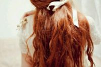 12 long wavy red hair with a poytail incorporated and a creamy bow for a romantic bride
