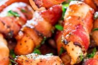 12 sweet chicken bacon bites with fresh greenery and spices are delicious